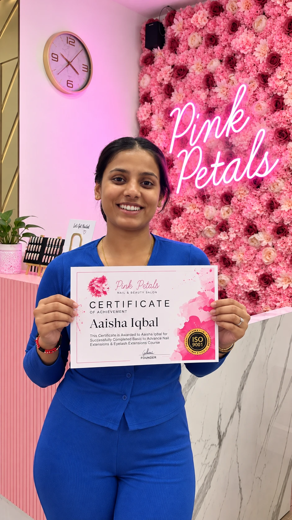 Pink Petals eyelash extension course student holding her certificate